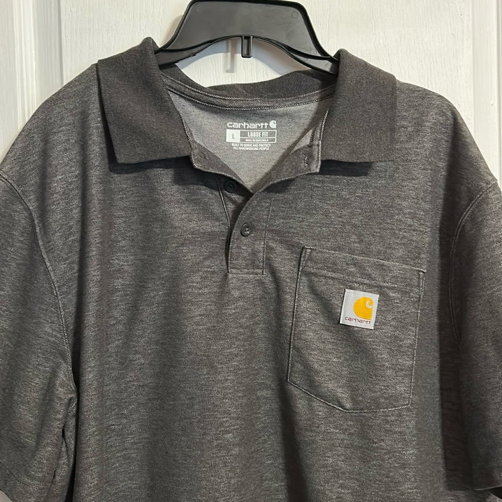 Men’s short sleeve Polo Carhartt Size Large  . Logo on pocket. Loose fit
